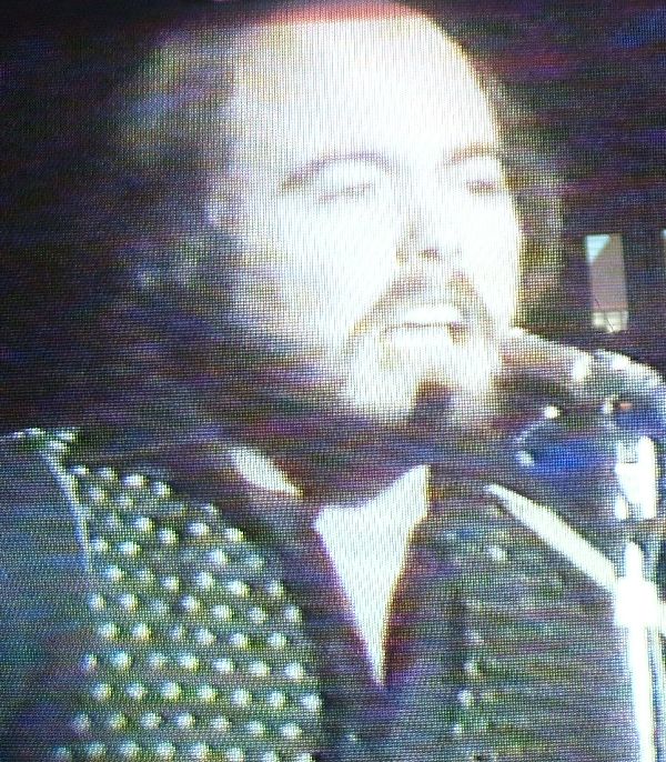 Iain on TotP singing Easy Come Easy Go.